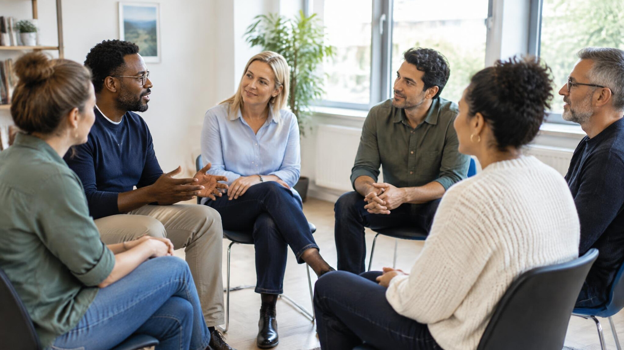 Colleagues sitting in a circle during a group session